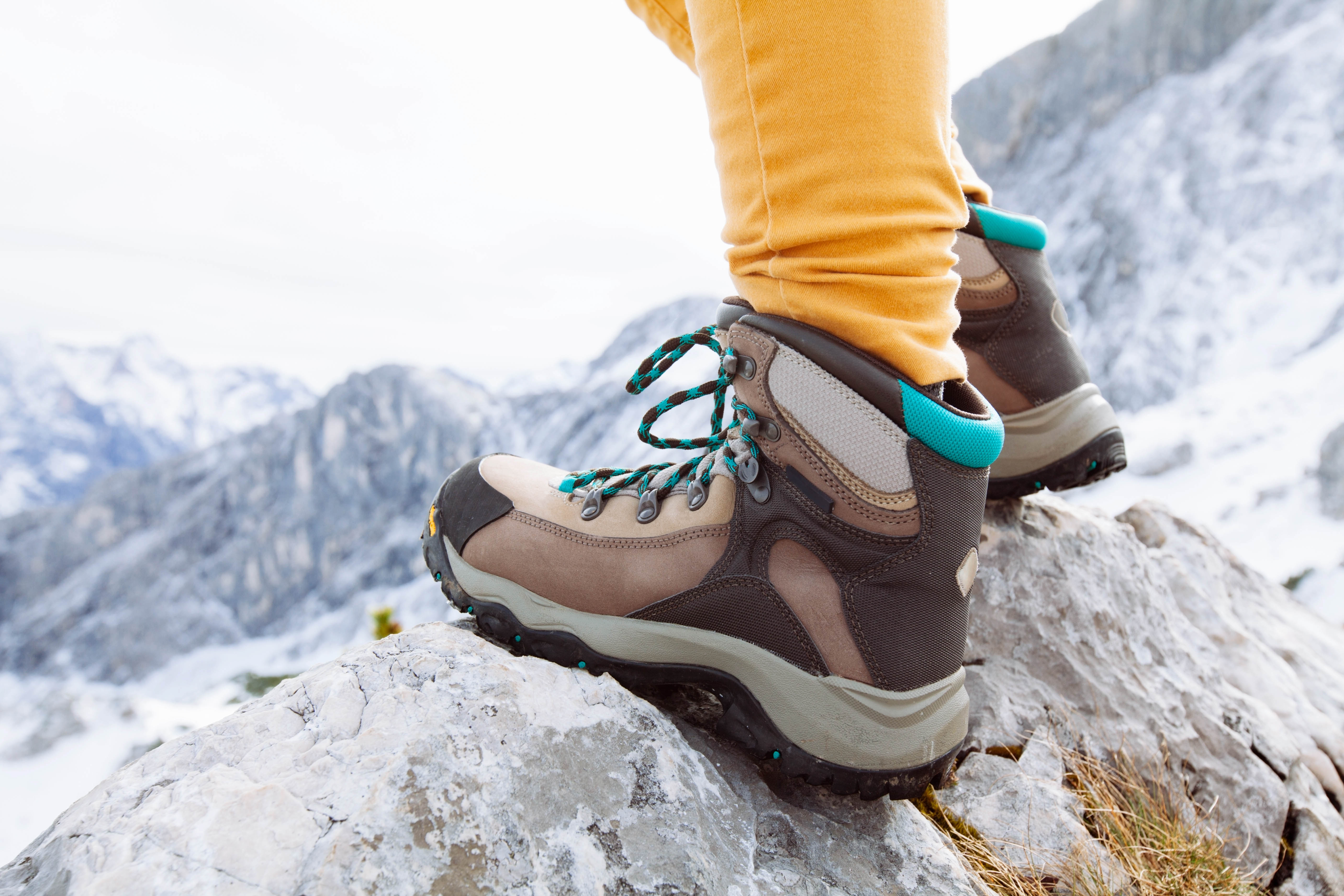 Close-up of a foot in a winter hiking boot, while up on a mountain